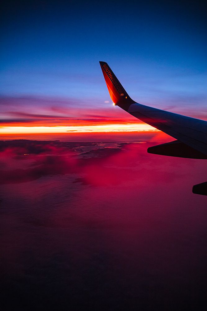 Aerial sunset view from airplane window above California, USA